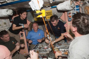 astronauts enjoying dinner