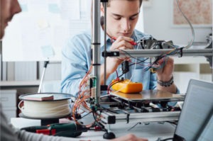 man using 3D printer for prototyping