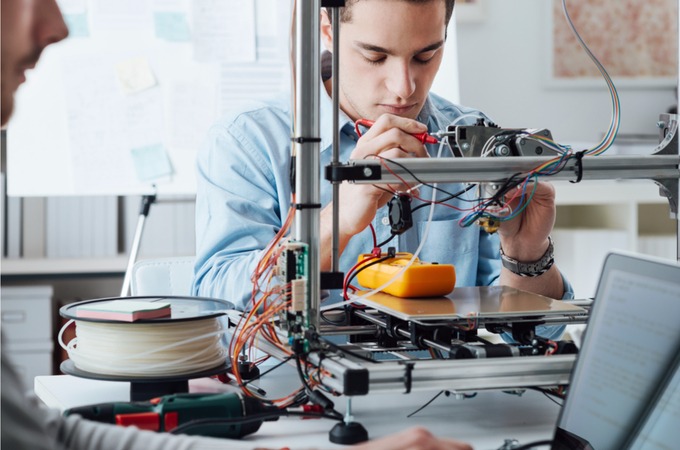 man using 3D printer for prototyping