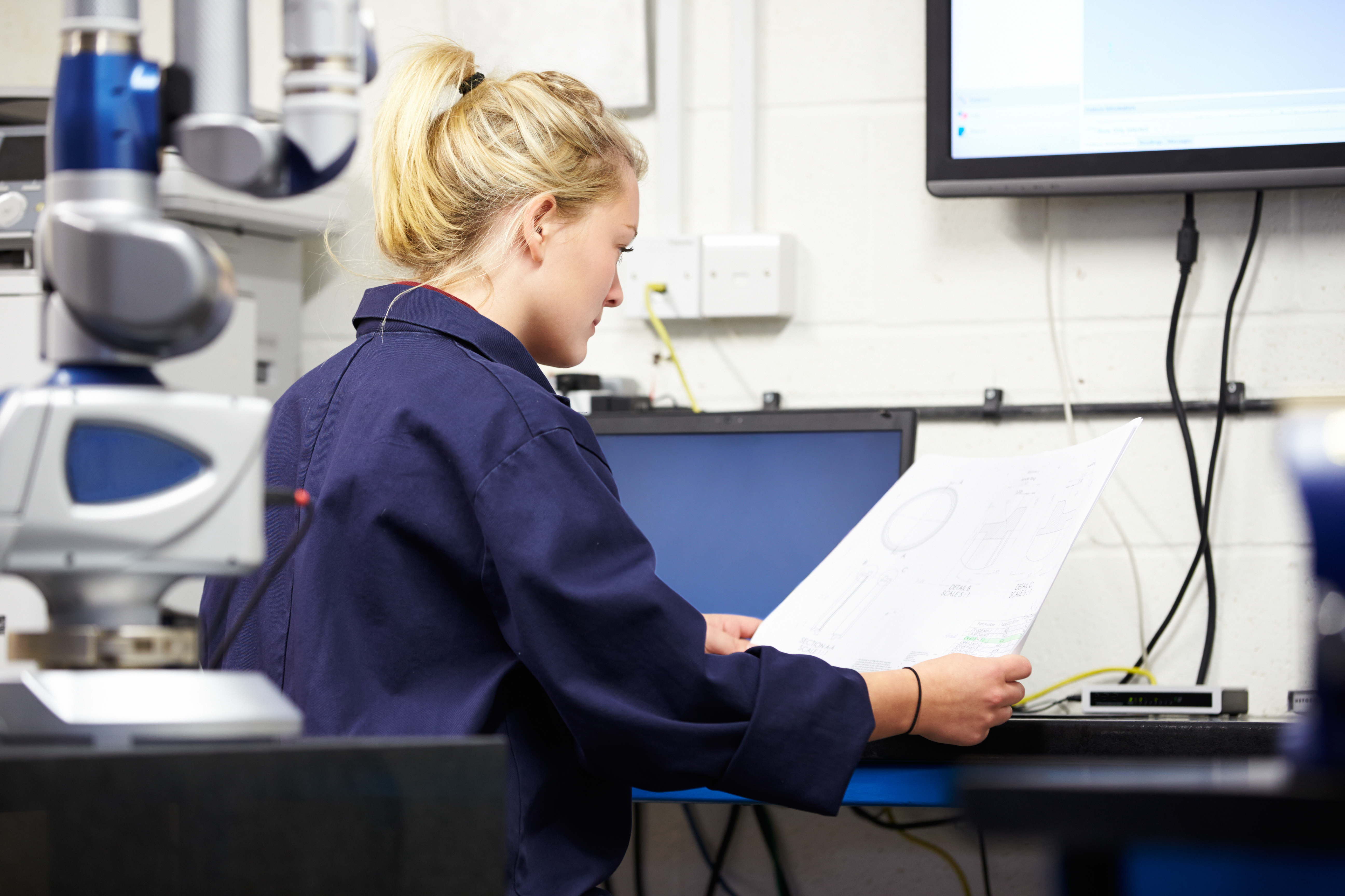 trainee engineer studying plans
